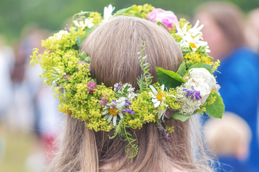 Young girl crowned by flowers (c) Stefan Holm / shutterstock