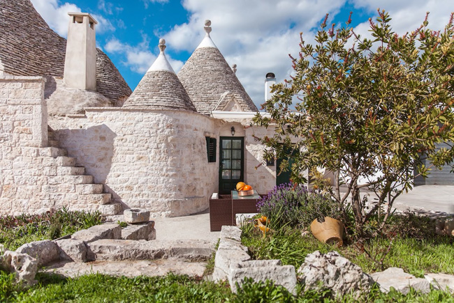 Trullo, traditional Apulian dry stone huts, of 1800 in the Itria Valley, Italy. © airbnb / Biagio