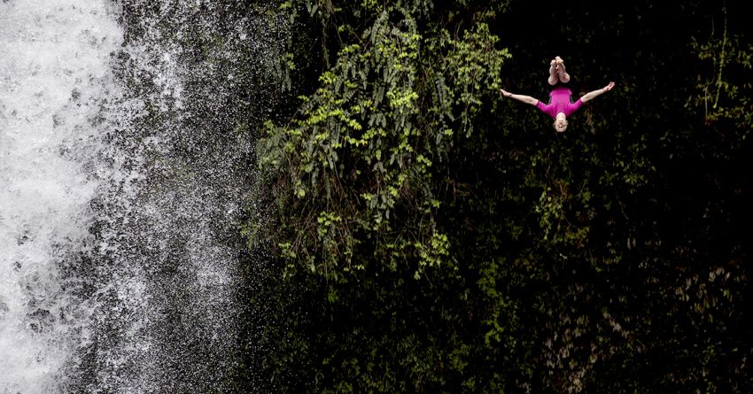 Yana Nestsiarava of Belarus dives from the 21 metre platform during a training session of the Red Bull Cliff Diving World Series at Rininahue waterfall, Lago Ranco, Chile. © Dean Treml/Red Bull Content Pool