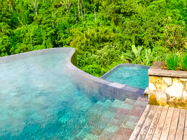 You swim in the Ubud Hanging Gardens pool in the middle of Bali’s jungle – Solarisys / Shutterstock.com